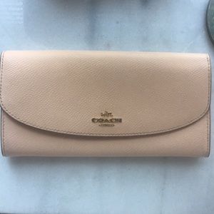 Pale pink coach wallet